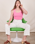 Tank Top in Bubblegum Pink on Allison wearing vintage tee off-white Western Pants sitting in green chair