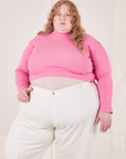 Catie is wearing 3XL Essential Turtleneck in Bubblegum Pink paired with vintage tee off-white Western Pants