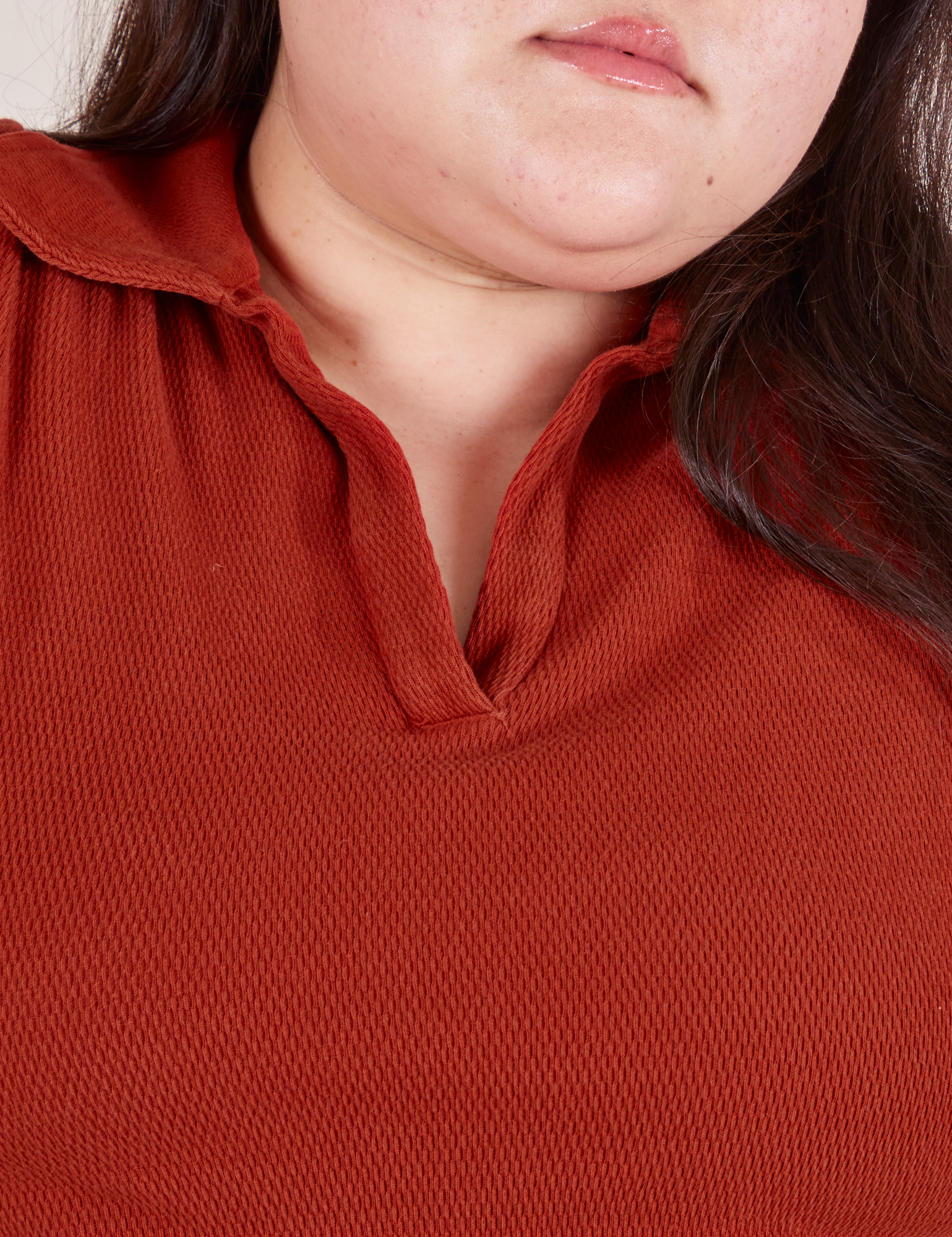 Front close up of Long Sleeve Fisherman Polo in Paprika worn by Ashley