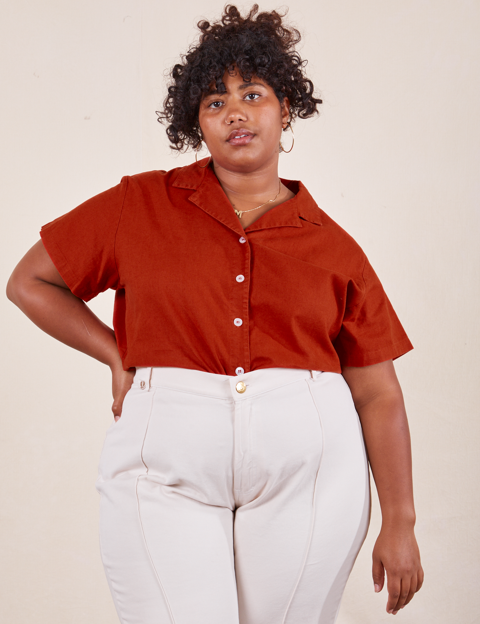Morgan is wearing 1XL Pantry Button-Up in Paprika tucked into vintage tee off-white Western Pants
