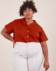 Morgan is wearing 1XL Pantry Button-Up in Paprika tucked into vintage off-white Western Pants