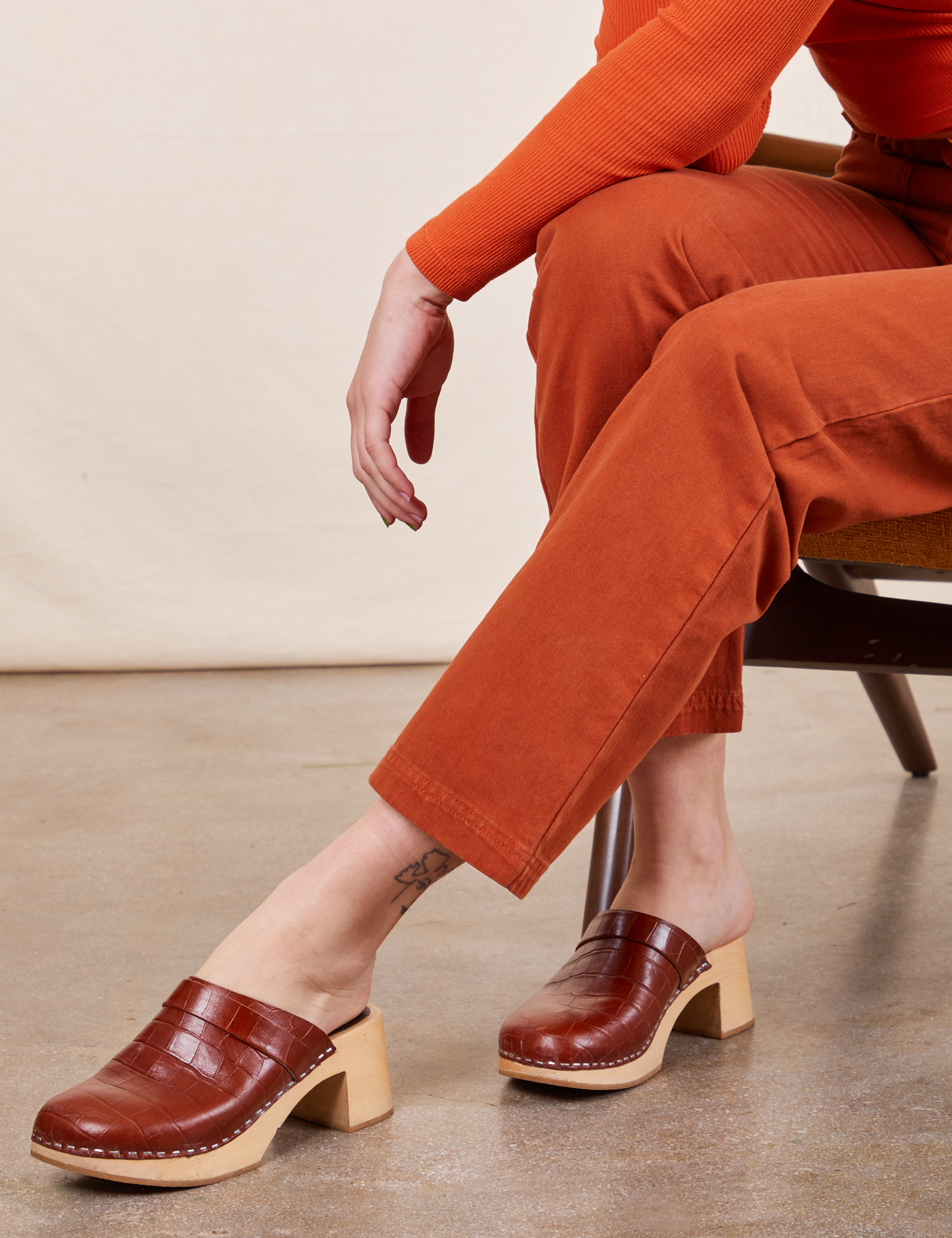 Work Pants in Burnt Terracotta leg close up on Alex