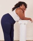 Side view of Western Pants in Navy Blue and vintage off-white Tank Top on Morgan