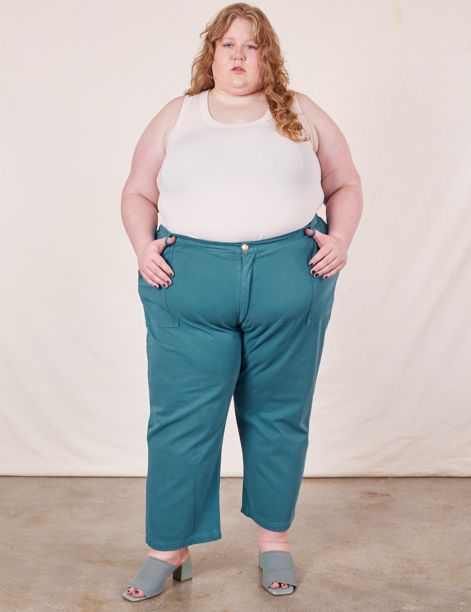 Catie is 5&#39;11&quot; and wearing 5XL Work Pants in Marine Blue paired with Tank Top in vintage tee off-white