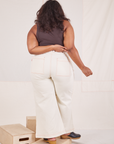 Back view of Bell Bottoms in Vintage Off-White and espresso brown Tank Top worn by Morgan