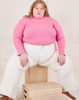 Catie is wearing Essential Turtleneck in Bubblegum Pink and vintage tee off-white Western Pants