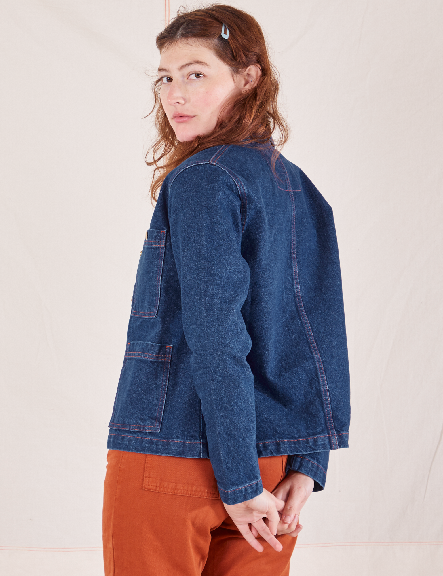 Angled back view of Indigo Denim Work Jacket in Dark Wash worn by Alex