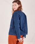Angled back view of Indigo Denim Work Jacket in Dark Wash worn by Alex