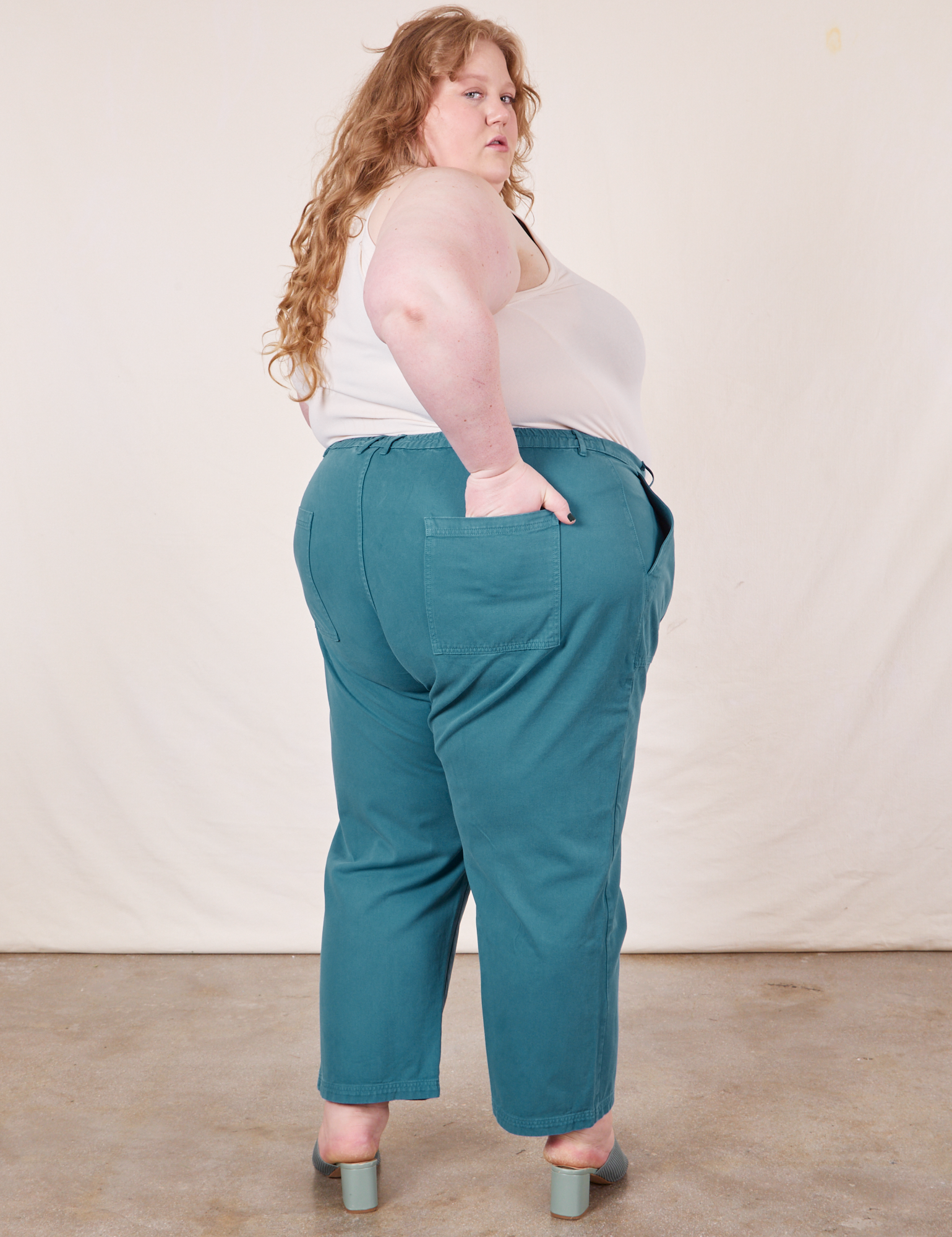 Work Pants in Marine Blue back view on Catie wearing Tank Top in vintage tee off-white