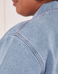 Indigo Denim Work Jacket in Light Wash  shoulder close up on Morgan