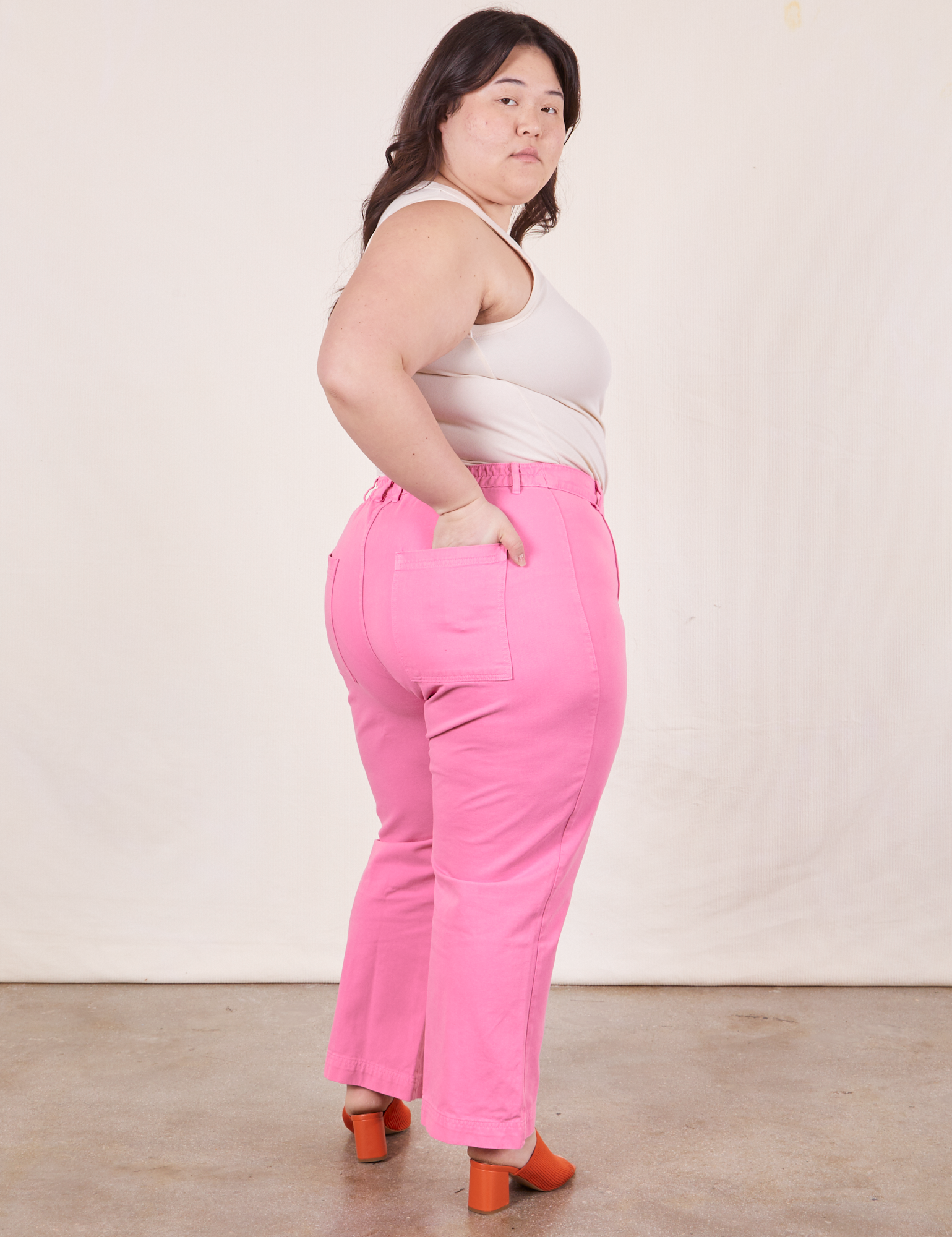 Western Pants in Bubblegum Pink back view on Ashley wearing Tank Top in vintage tee off-white