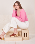  Long Sleeve V-Neck Tee in Bubblegum on Allison wearing vintage off-white Western Pants sitting on wooden crate