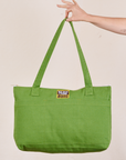 XL Zip Tote in Bright Olive held by model