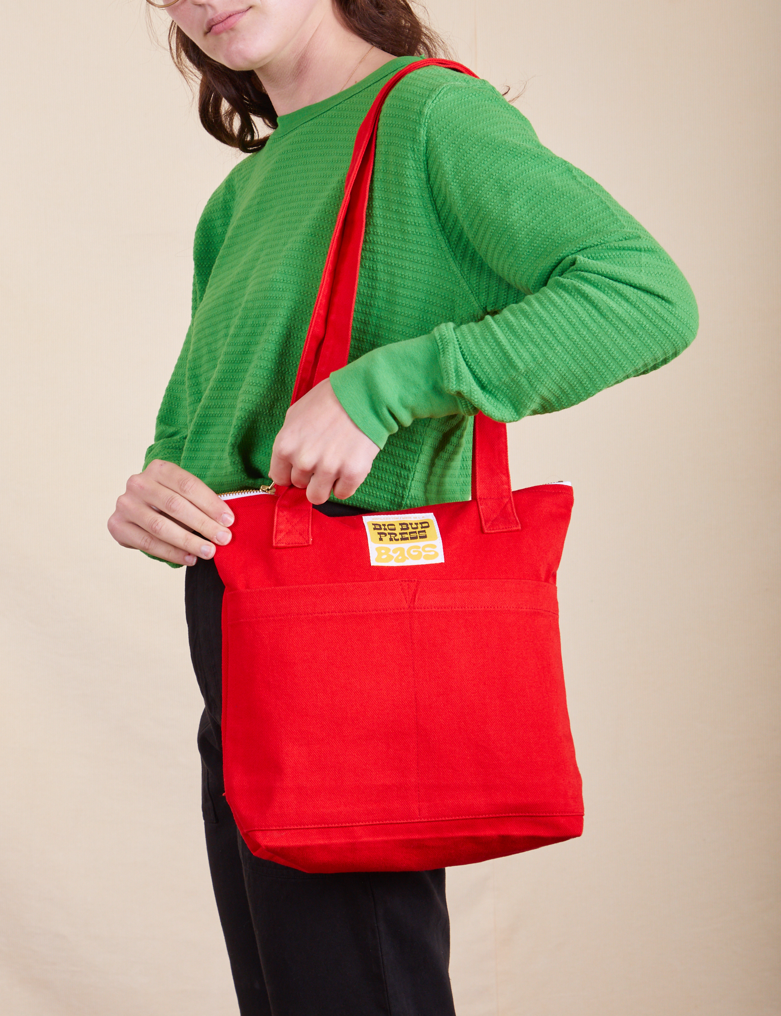 Over-Shoulder Zip Mini Tote in mustang red worn by model