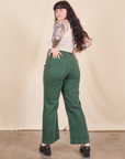 Back view of Western Pants in Dark Emerald Green and vintage off-white Tank Top on Sydney