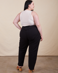 Back view of Work Pants in Basic Black and Tank Top in vintage tee off-white on Kenna