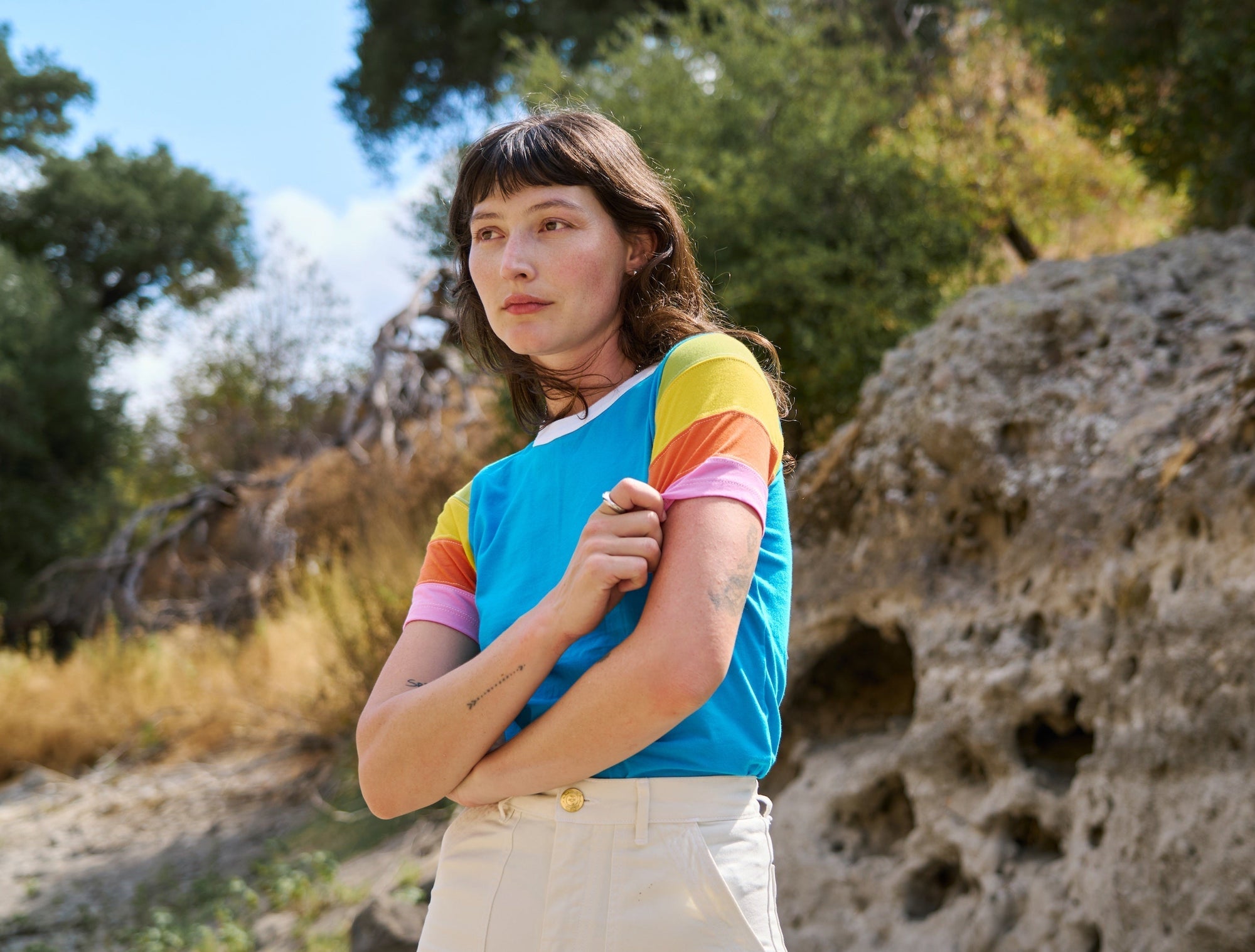 Alexandra Skye is wearing Calypso Tee in Rainbow and Work Pants in Vintage Tee White