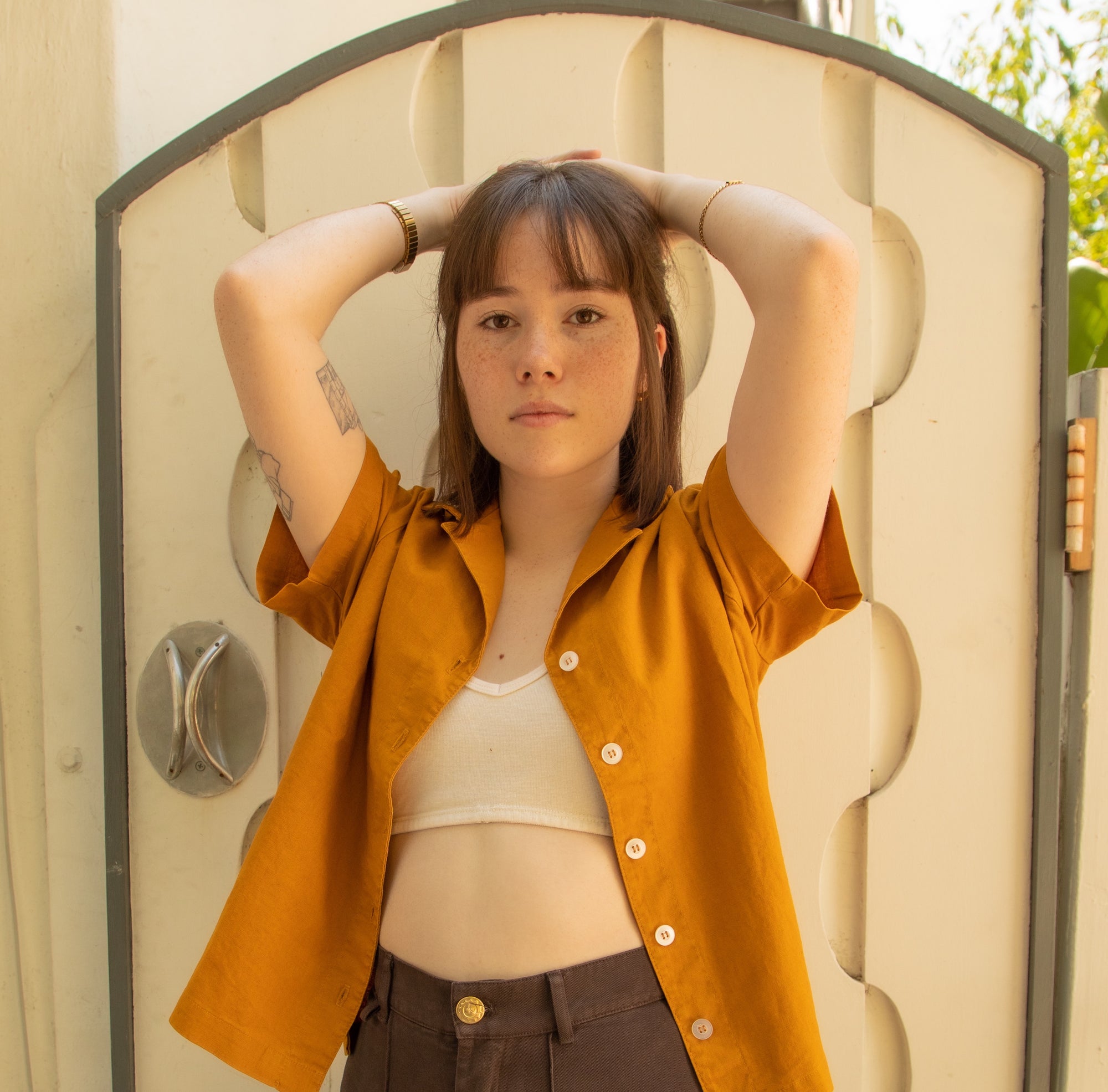 Hana wearing Pantry Button-Up in Spicy Mustard, Bralette in Vintage Off-White, and Petite Western Pants in Espresso Brown