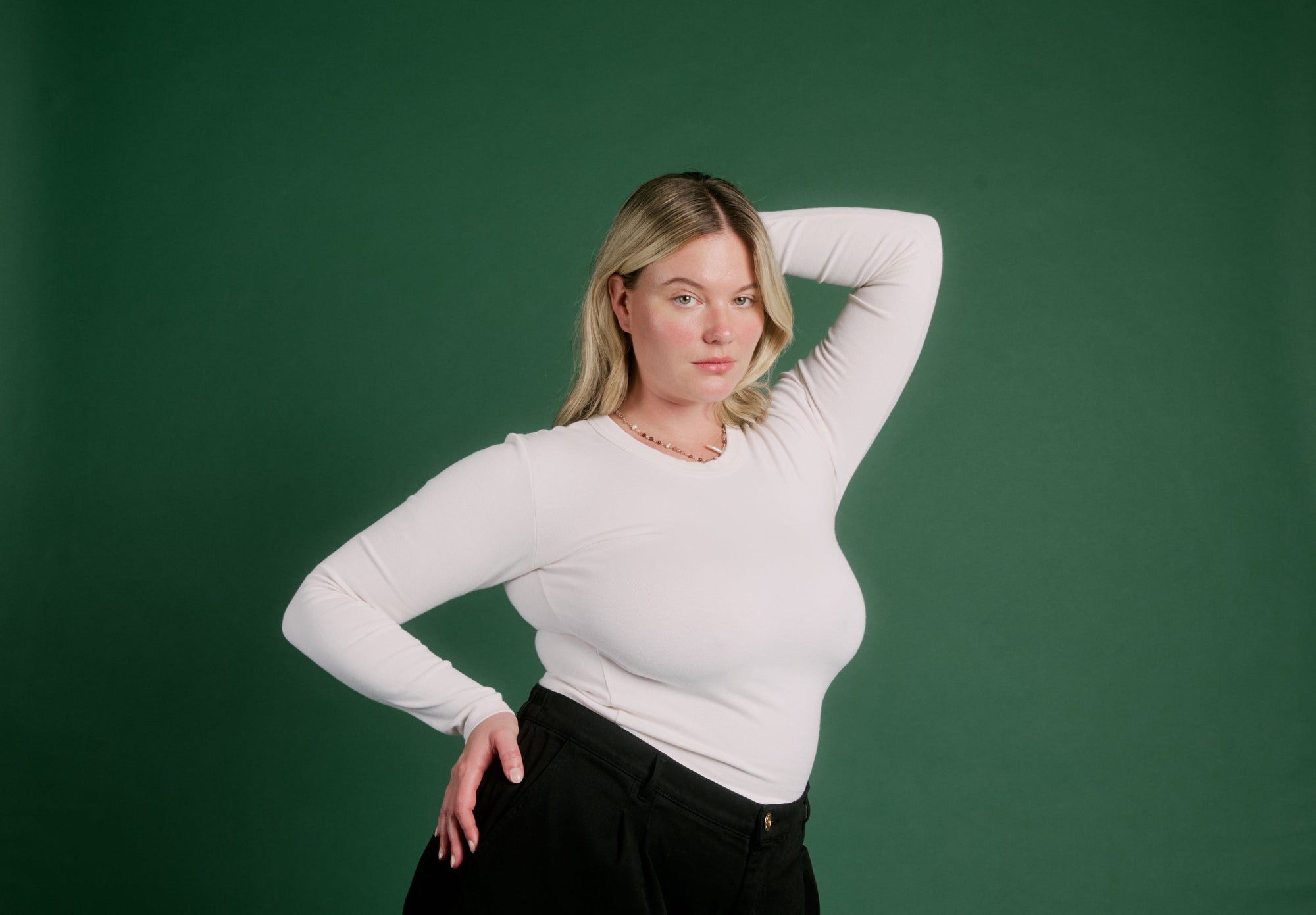 Lish is wearing Long Sleeve Baby Tee in Vintage Tee Off-White and Heavyweight Trousers in Basic Black