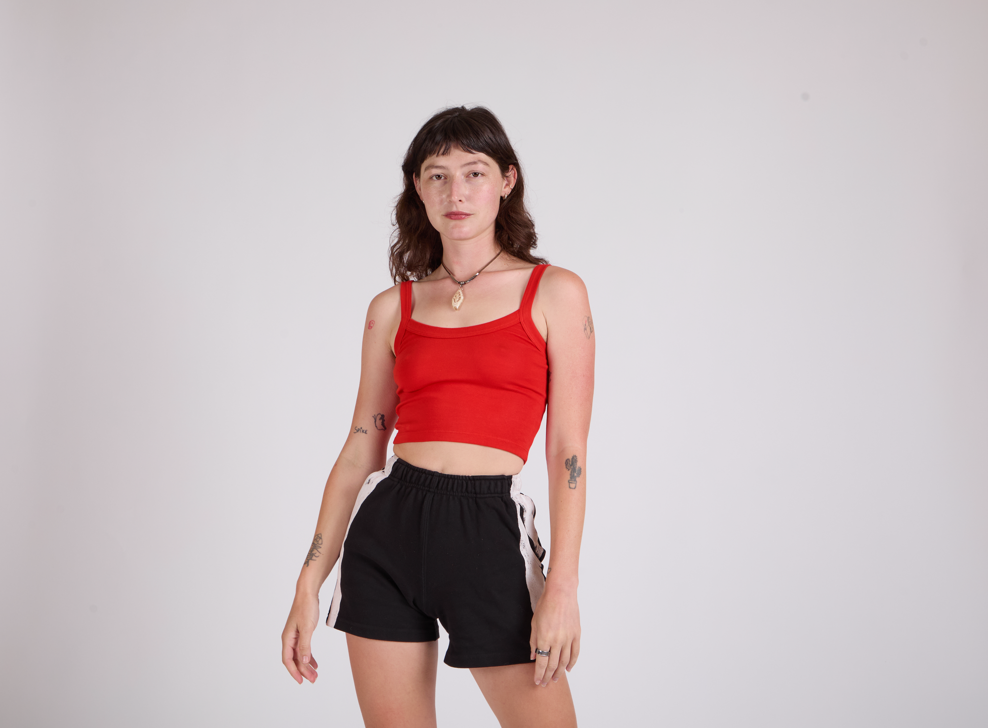 Alexandra Skye is wearing Painted Stripe Easy Short in Basic Black and Cropped Cami in Mustang Red