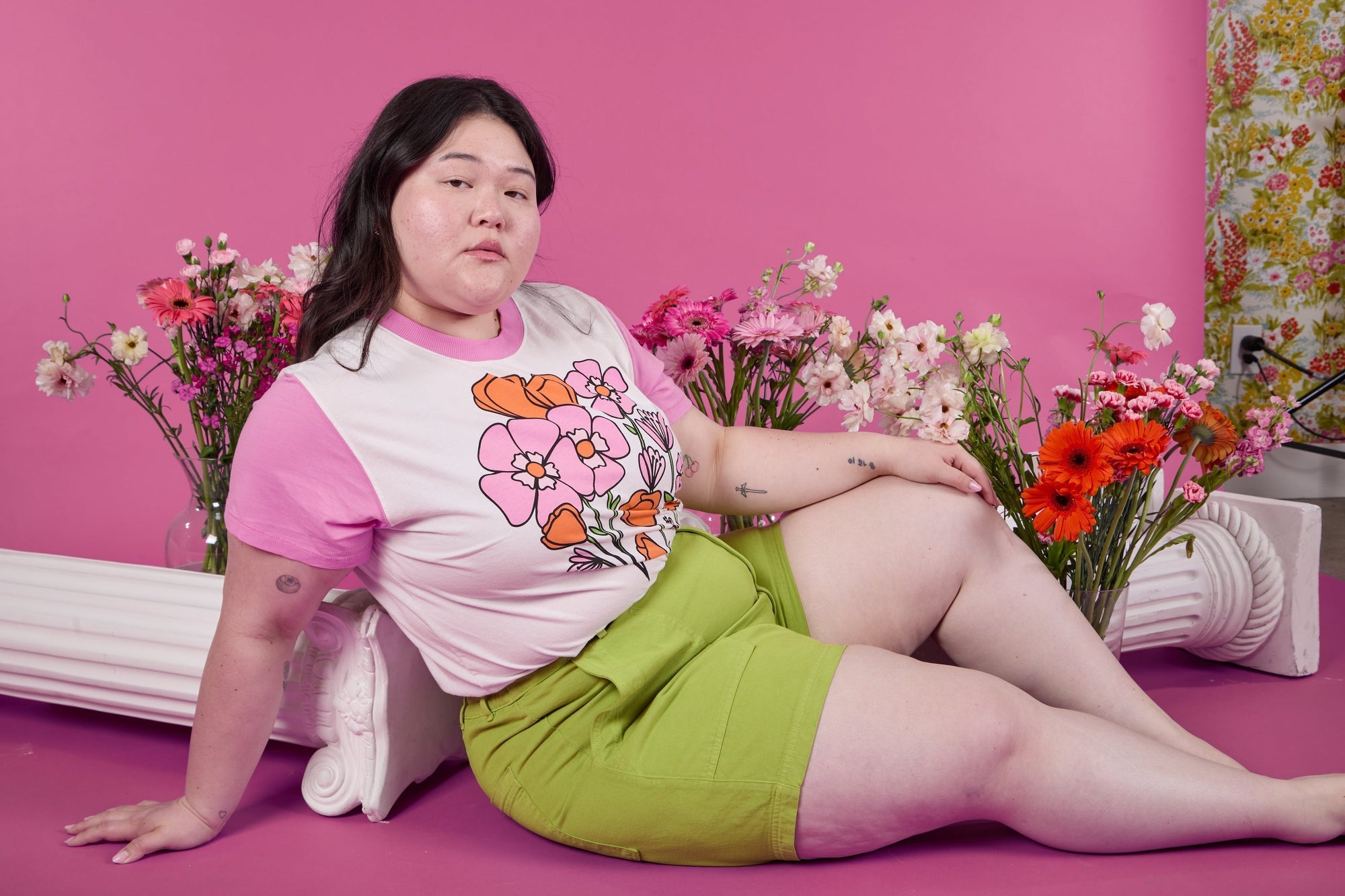 Ashley is wearing the Pink Poppy Anniversary Tee