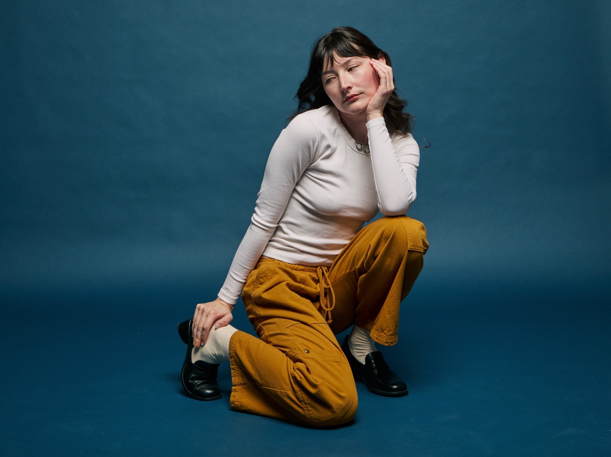 Alexandra Skye is wearing Long Sleeve Baby Tee in Vintage Tee White and Drop Pocket Cargo Pants in Spicy Mustard