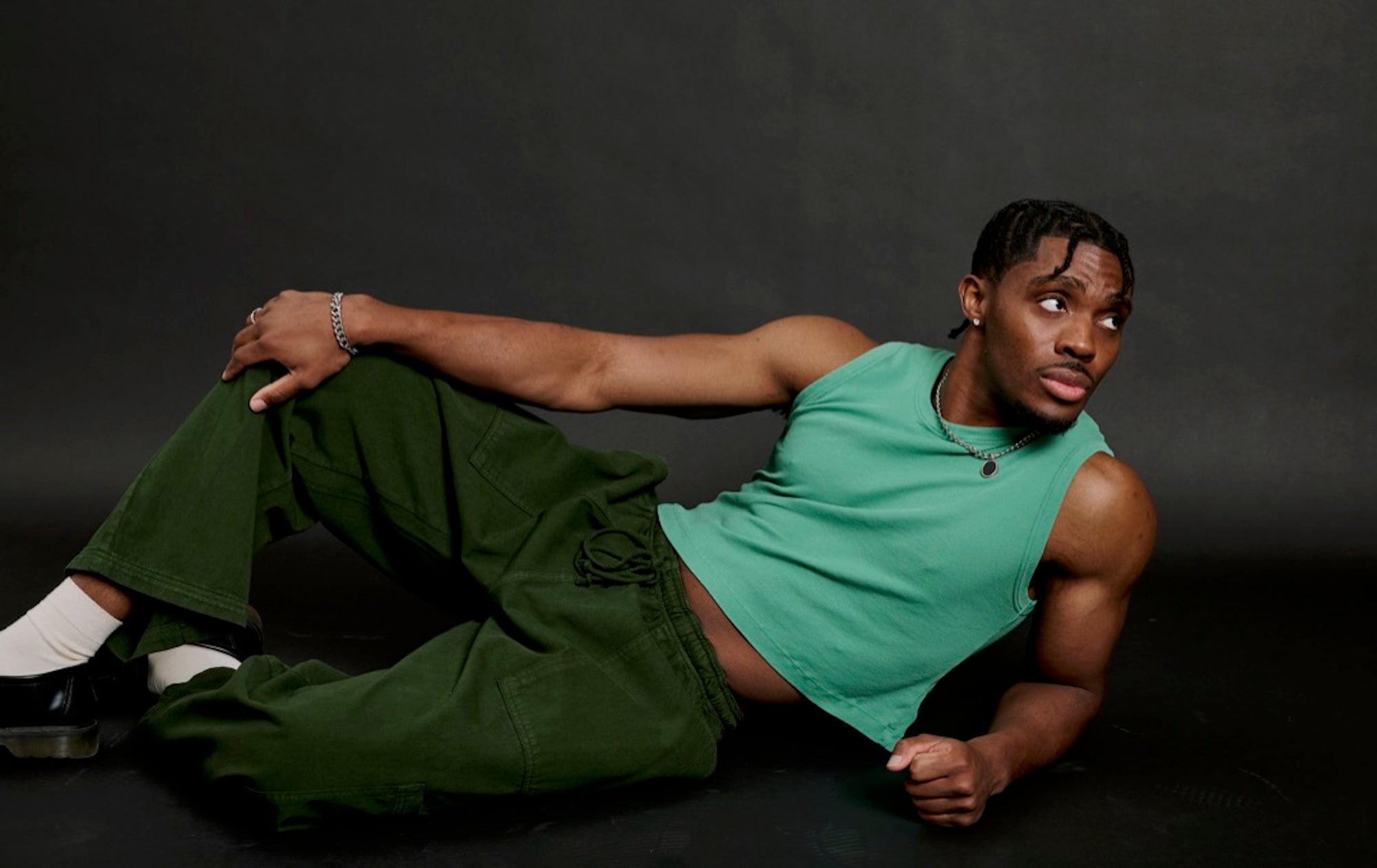 Isaac is wearing Muscle Tee in Seafoam and Drop Pocket Cargo Pants in Evergreen