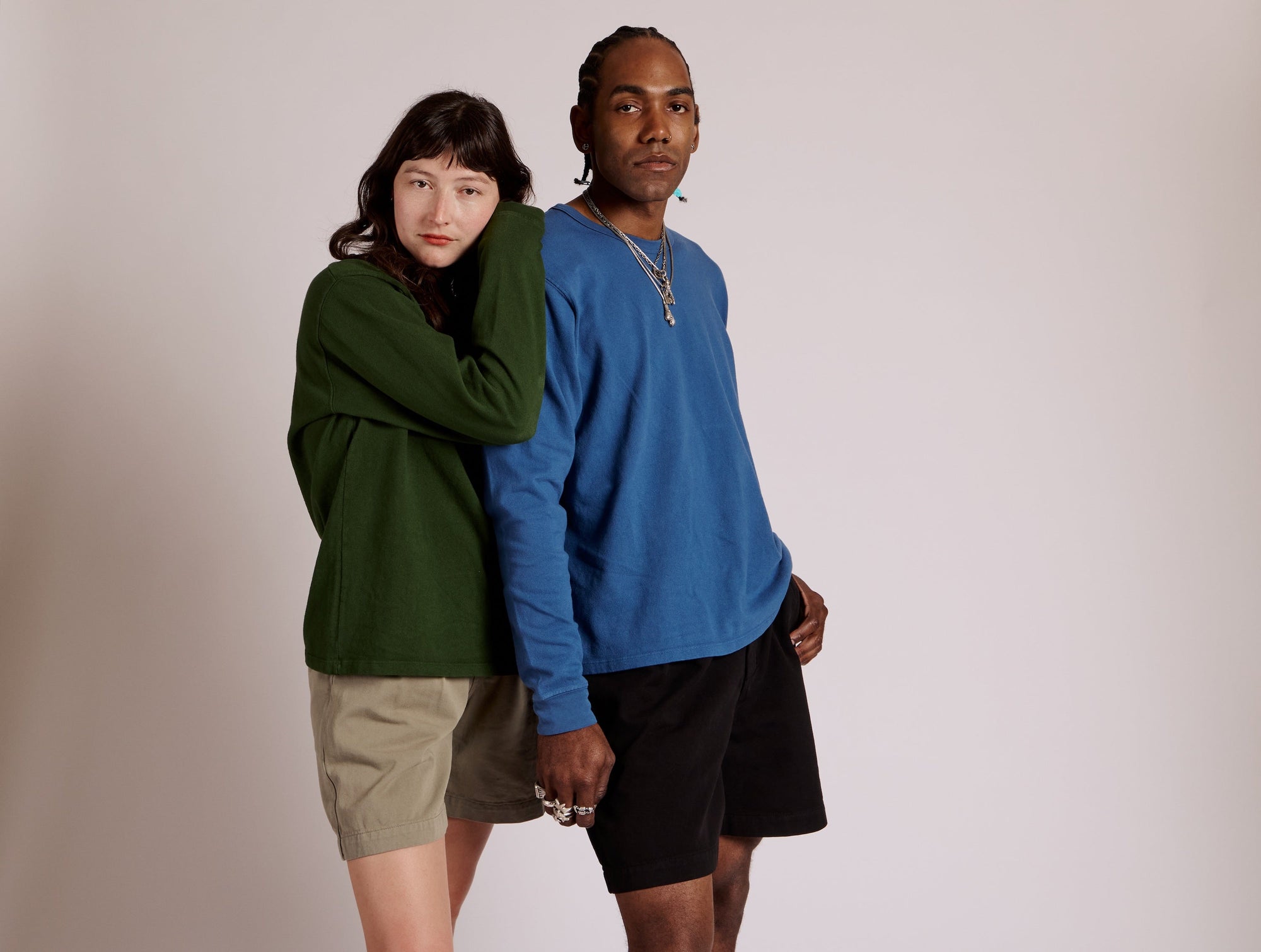 Alex is wearing Trouser Shorts in Khaki Grey paired with Long Sleeve Burly Tee in Evergreen. Jerrod is wearing Trouser Shorts in Black paired with Long Sleeve Burly Tee in French Blue.
