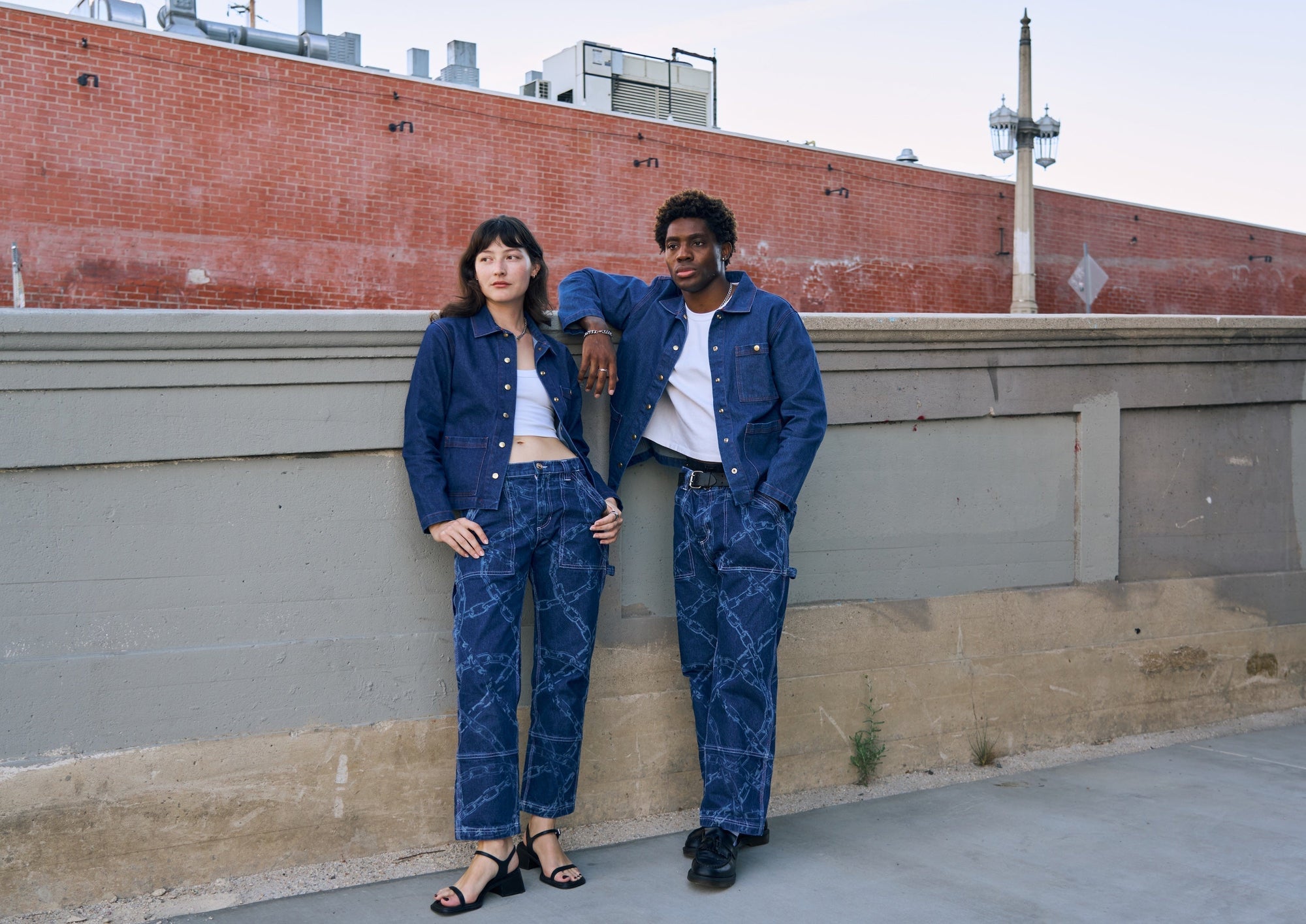 Alexandra Skye and Issac are wearing Mid Rise Carpenter Jeans in Chain and Indigo Denim Work Jacket in Dark Wash