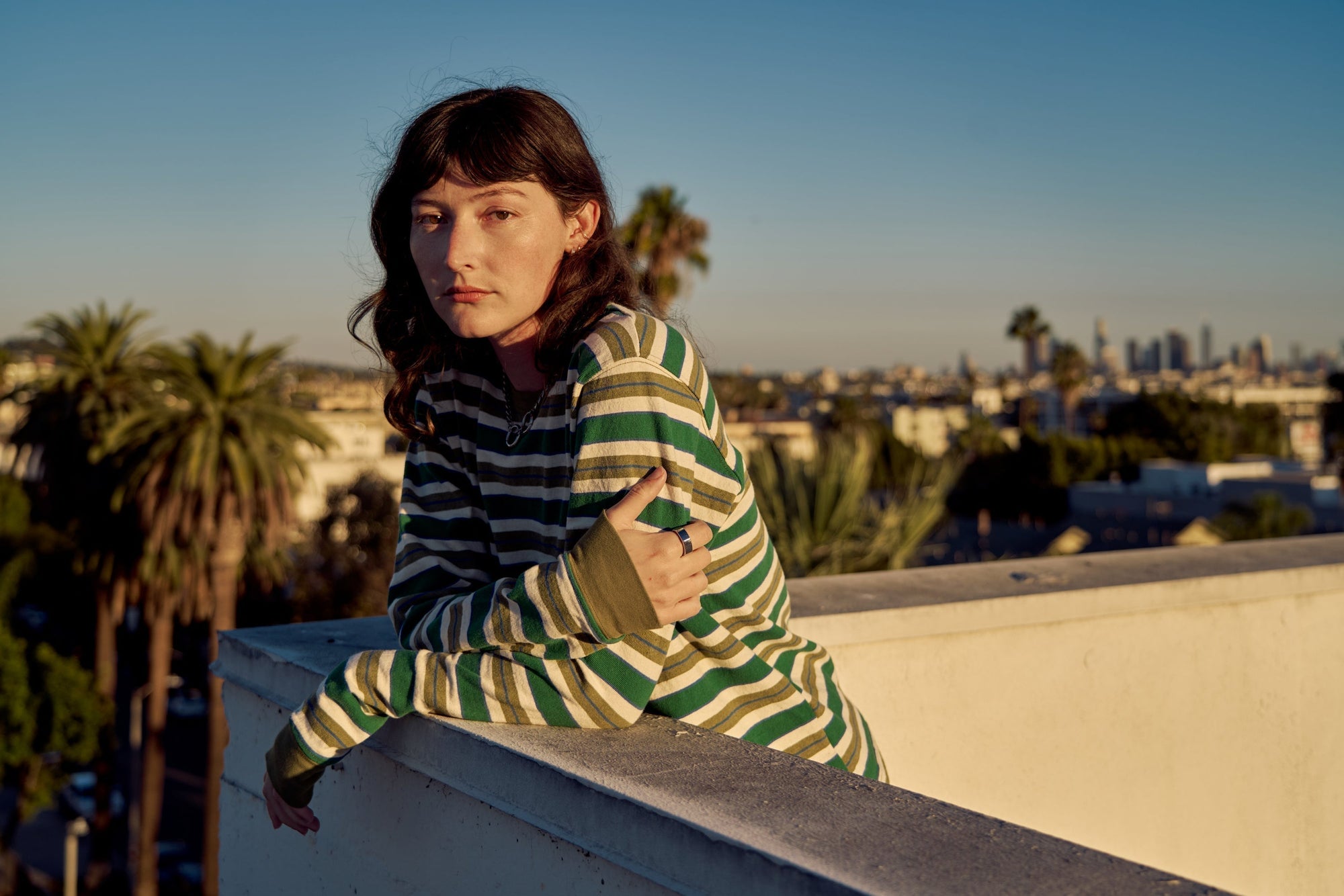 Alexandra Skye is wearing Striped Long Sleeve Burly Tee in Blue & Green paired with Drop Pocket Cargo Pants in Evergreen