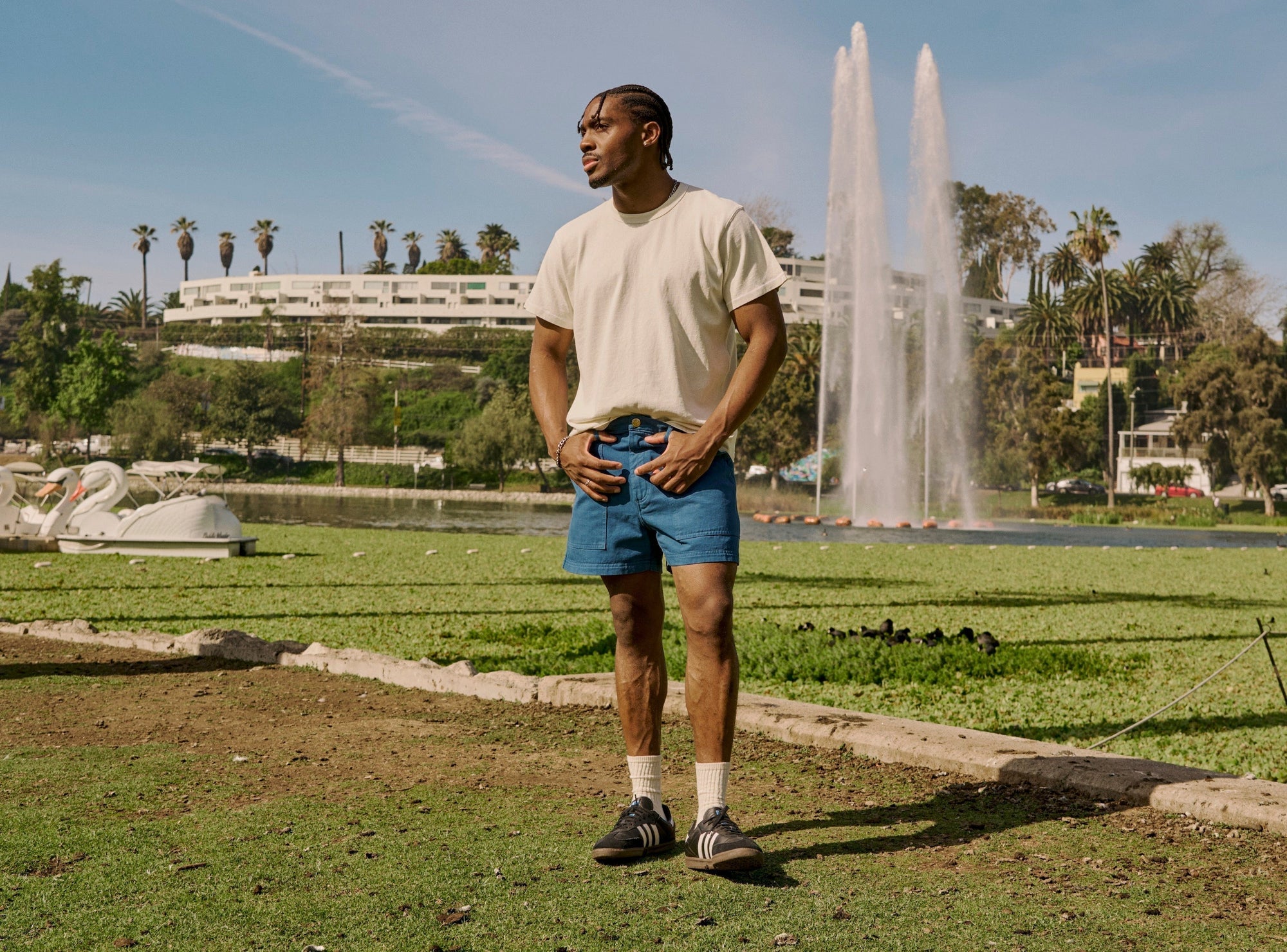 Isaac is wearing Work Shorts in French Blue and Burly Tee in Vintage Tee White