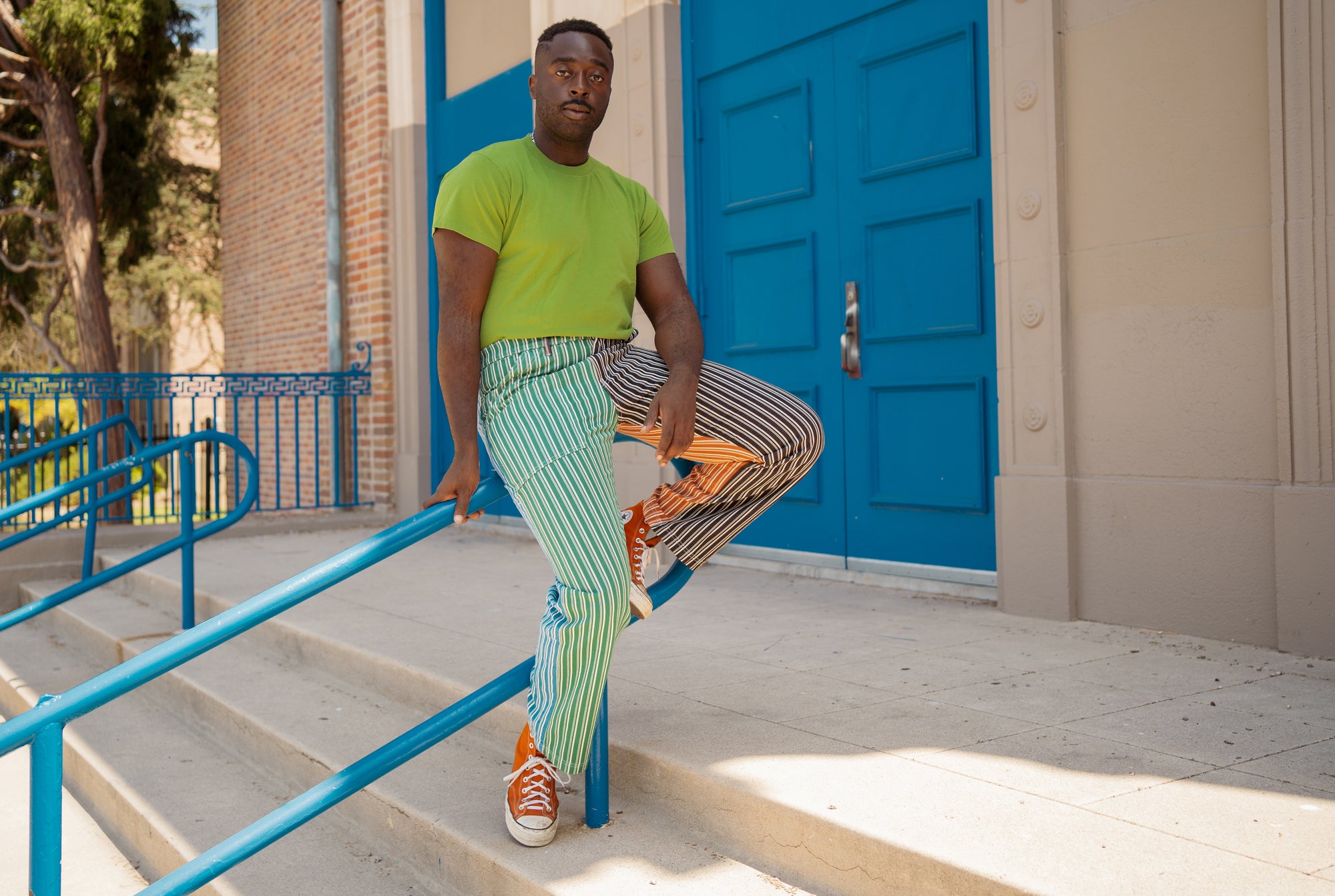 Eli wearing 4 Color Multi-Stripe Work Pant and Organic Vintage Tee in Bright Olive