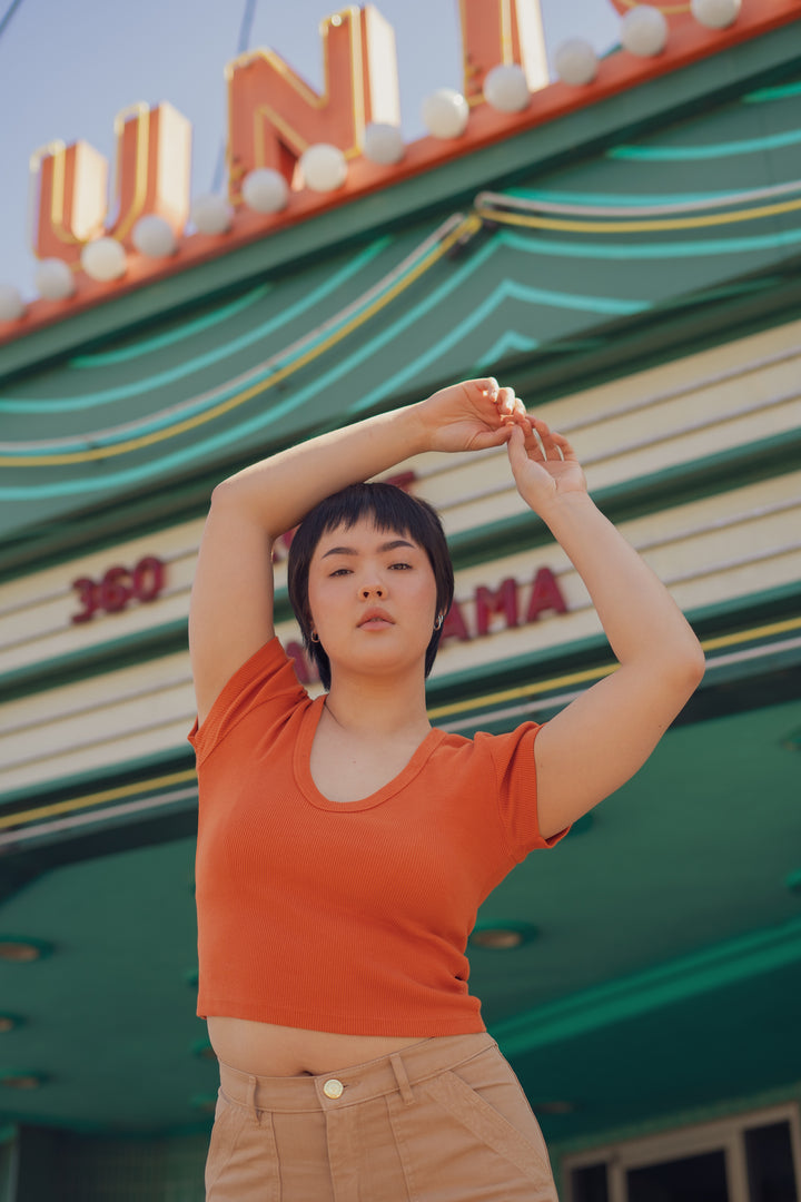 Annika wearing V-Neck Tee in Burnt Orange and Petite Work Pants in Tan