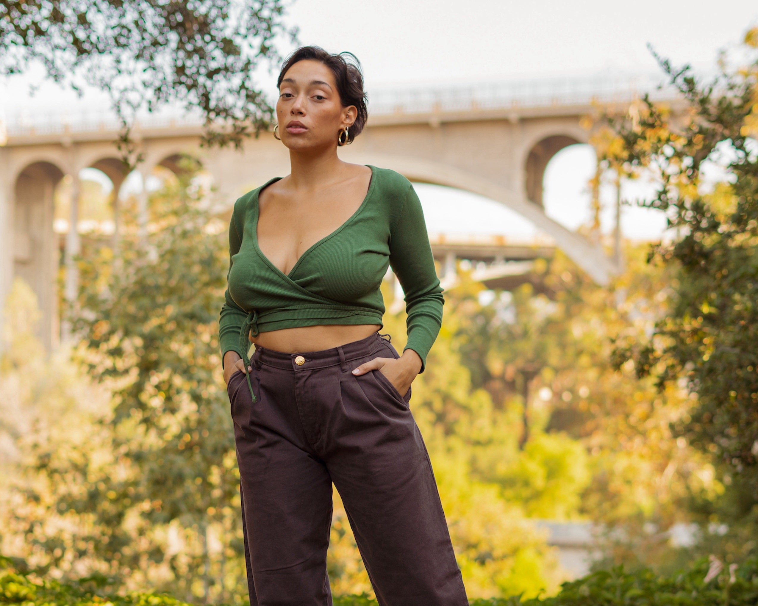 Tiara wearing Wrap Top in Dark Emerald Green and Trousers in Espresso Brown
