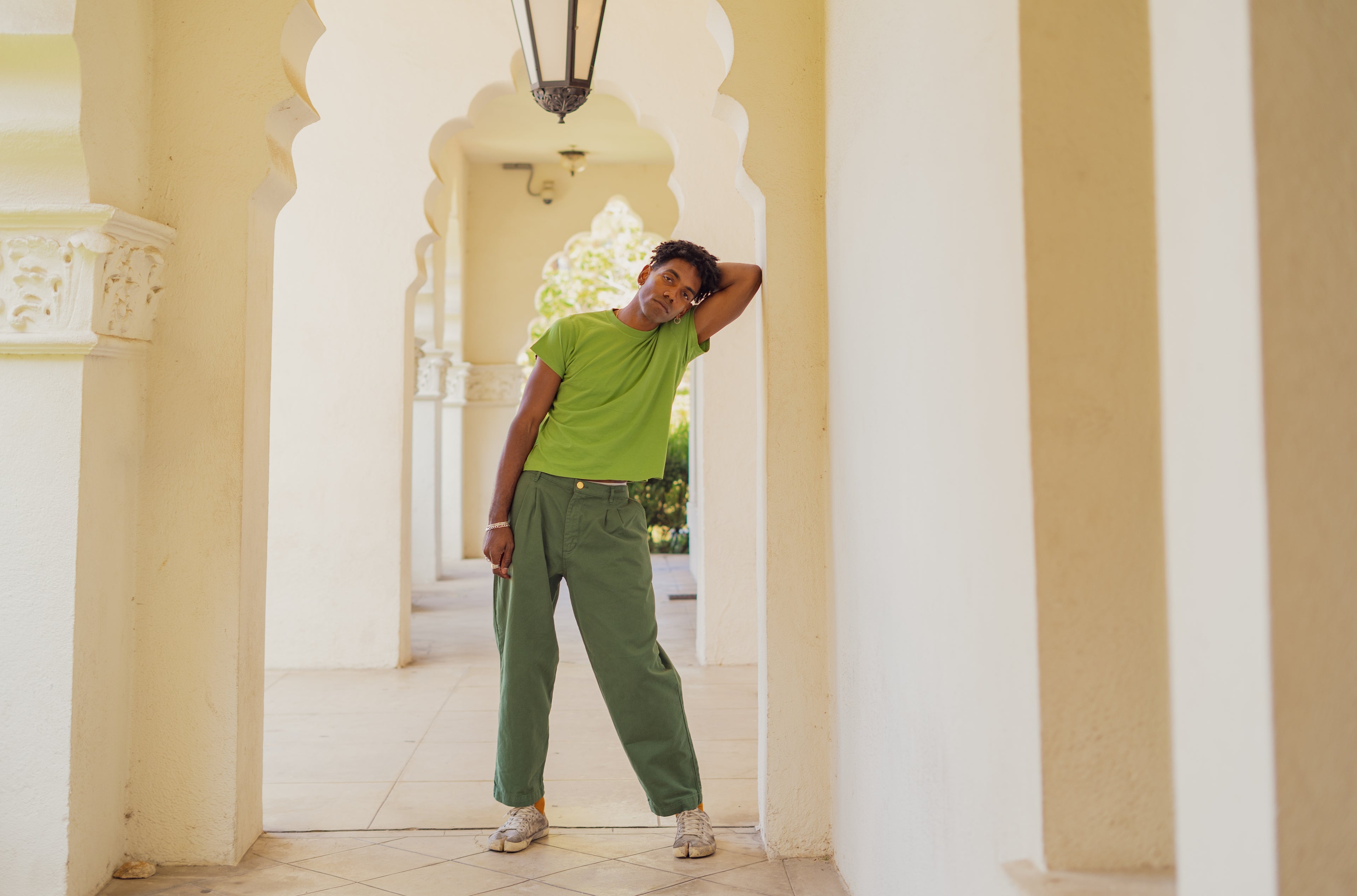 Jerrod wearing Organic Vintage Tee in Bright Olive and Heavyweight Trousers in Dark Emerald Green