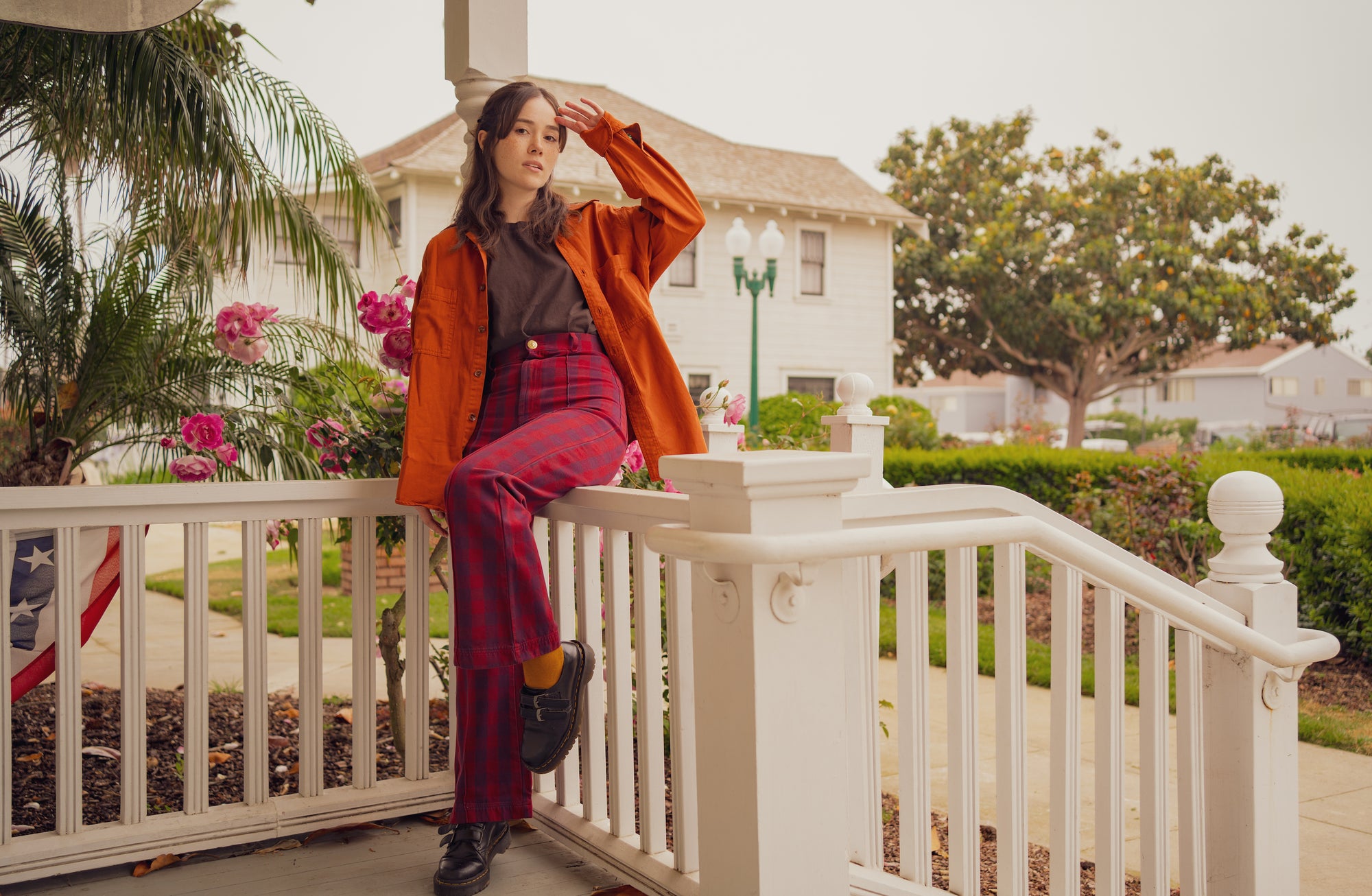 Hana is wearing Oversized Overshirt in Burnt Terracotta, Organic Vintage Tee in Fudgesicle Brown and Gingham Western Pants in Cranberry Red