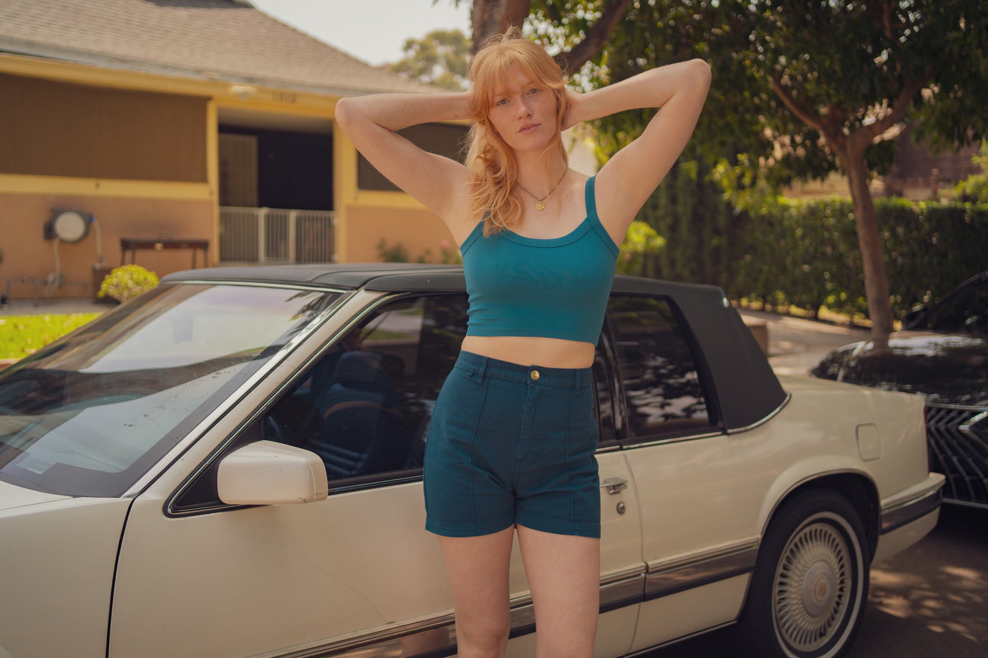 Margaret is wearing Western Shorts in Lagoon and Cropped Cami