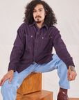 Jesse is wearing Corduroy Overshirt in Nebula Purple and light wash Denim Trouser Jeans