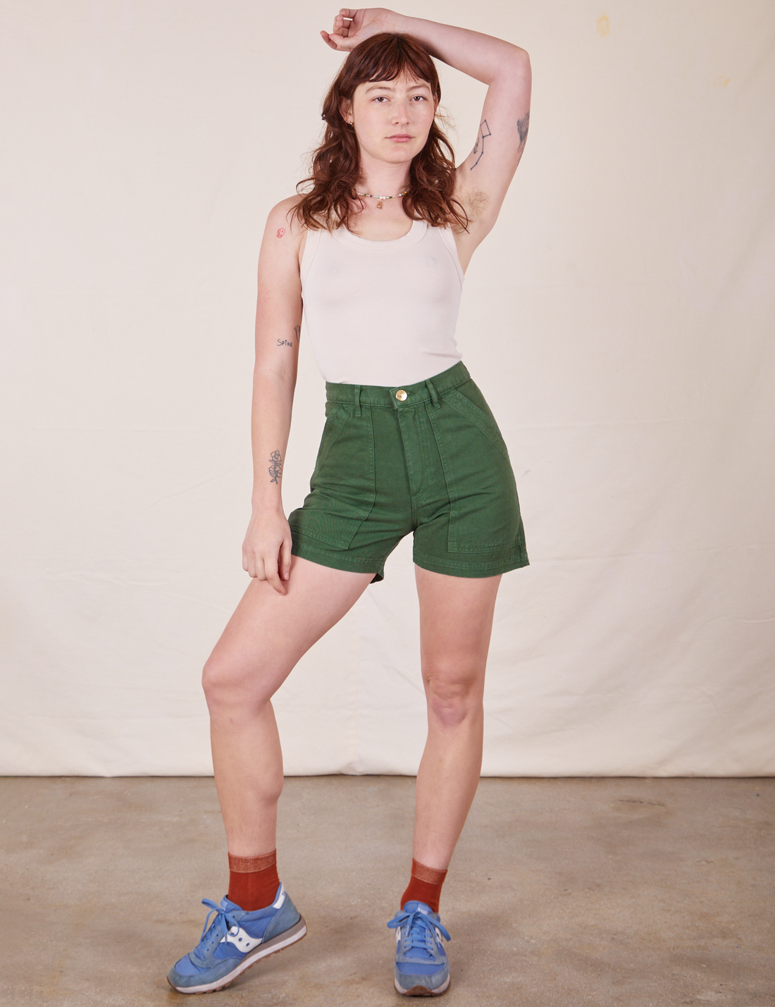 Alex is 5'8" and wearing XS Classic Work Shorts in Dark Emerald Green paired with vintage off-white Tank Top