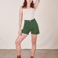 Alex is 5'8" and wearing XS Classic Work Shorts in Dark Emerald Green paired with vintage off-white Tank Top