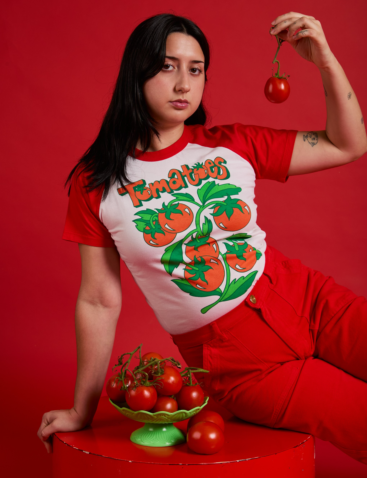 Betty is wearing Short Sleeve Raglan Tee in Tomatoes