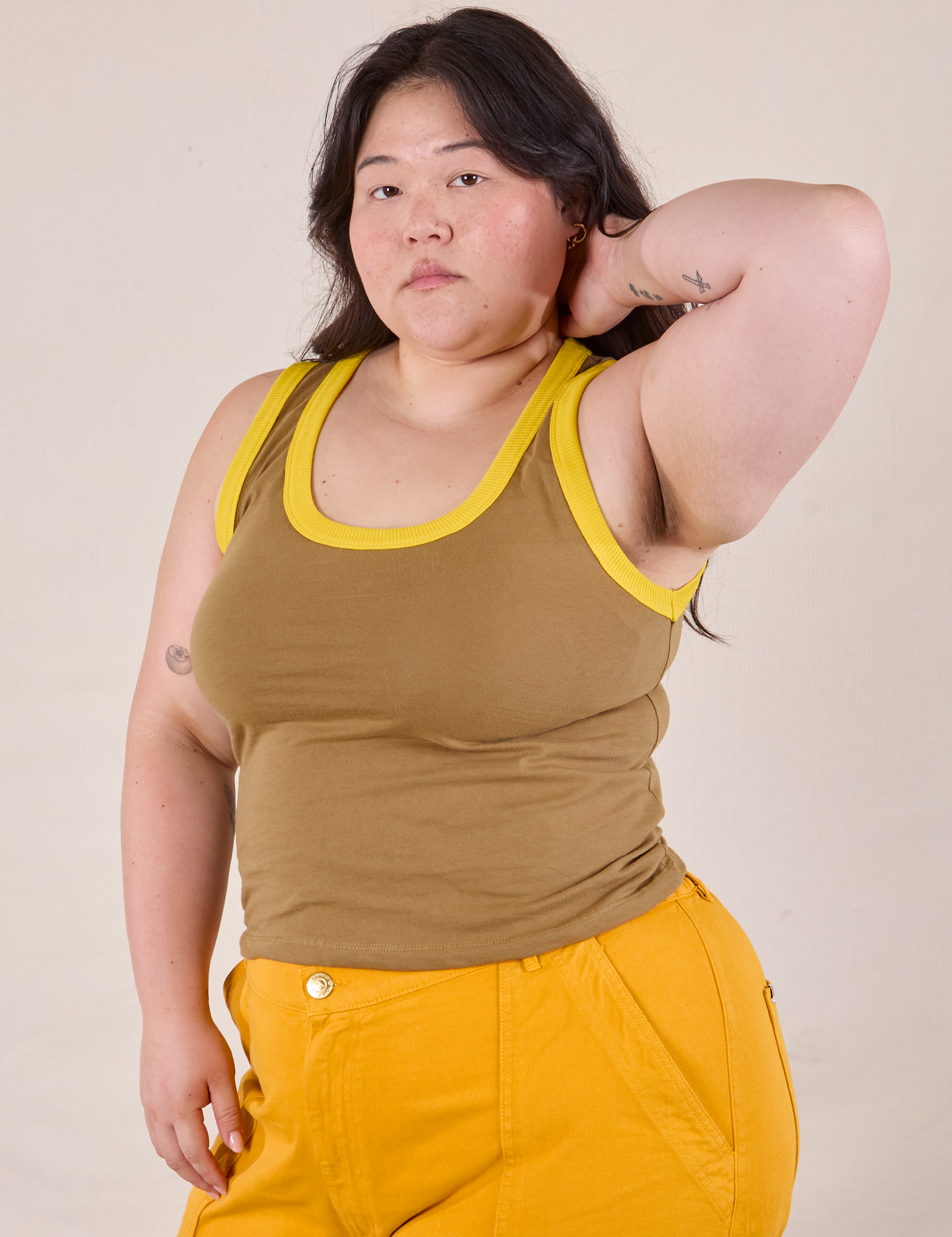 Ashley is 5'7" and wearing L Colorblock Cropped Tank in Desert Brown