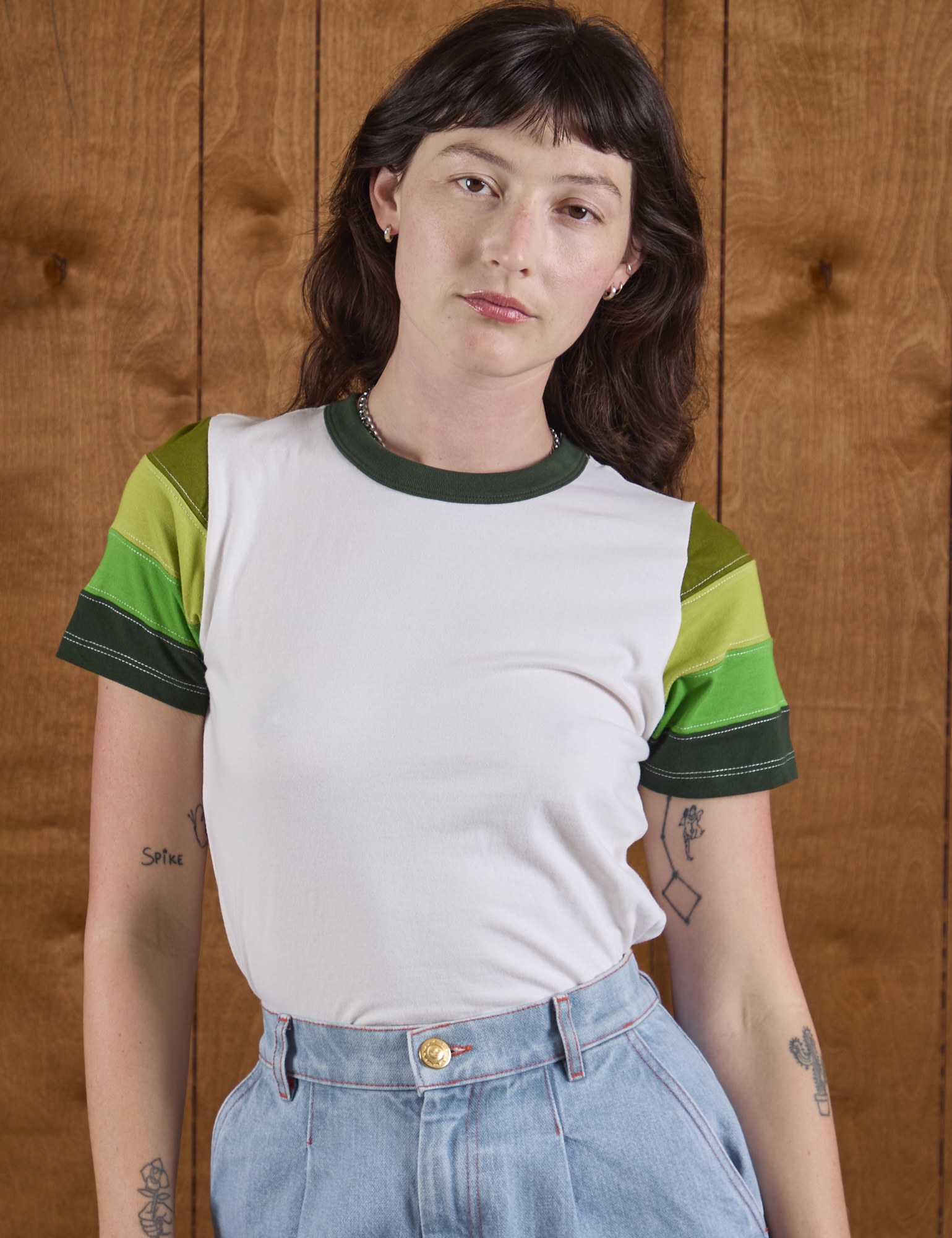 Alex is wearing P Calypso Tee in Forest
