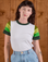 Alex is wearing P Calypso Tee in Forest