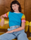 Alex is wearing Calypso Tee in Rainbow