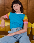 Alex is wearing Calypso Tee in Rainbow
