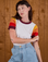 Alex is wearing size P Calypso Tee in Desert