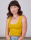 Alex is 5'8" and wearing P Cropped Tank Top in Golden Yellow