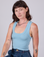 Alex is 5'8" and wearing P Cropped Tank Top in Baby Blue