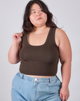 Ashley is 5'7" and wearing L Cropped Tank Top in Espresso Brown